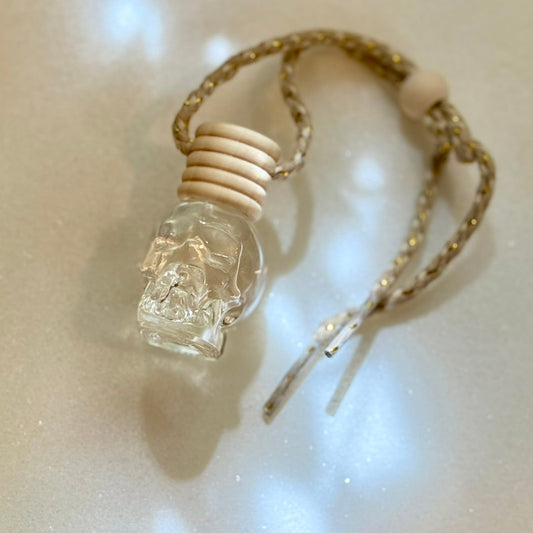 Small glass bottle with a wood cap on a beige background